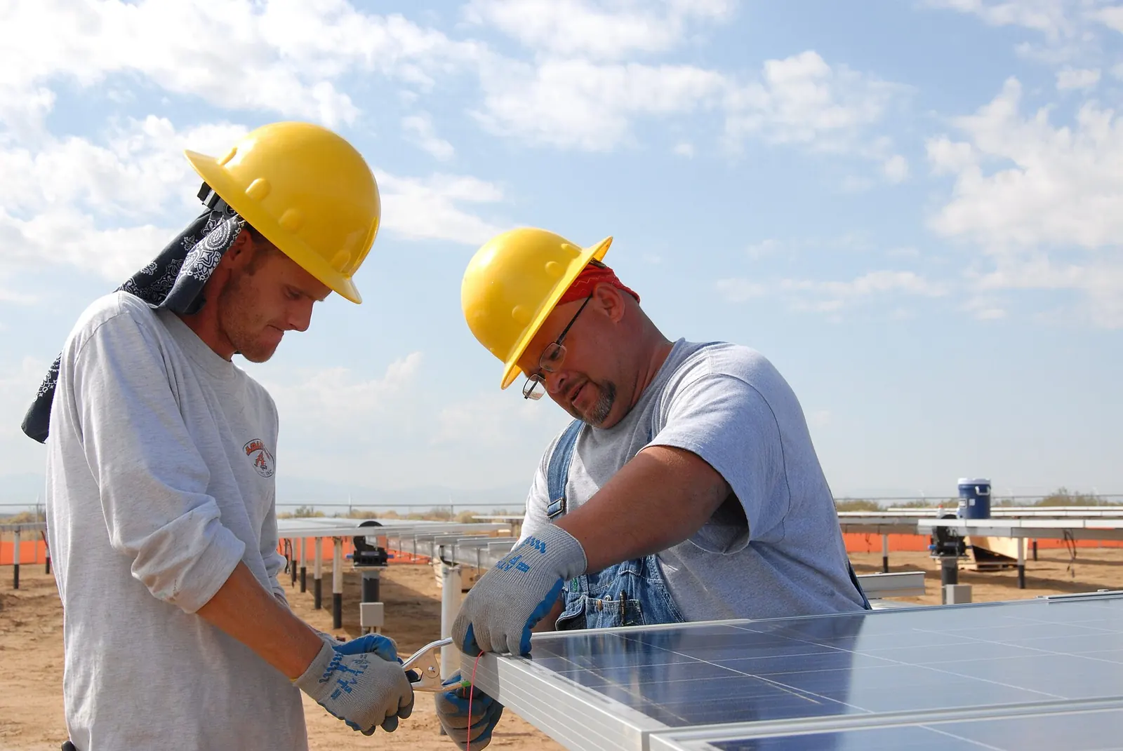 Workers installing solar panels at Edwards Air Force Base, California